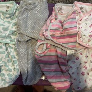 Lot of small/medium baby swaddles and one carters medium sleep sack